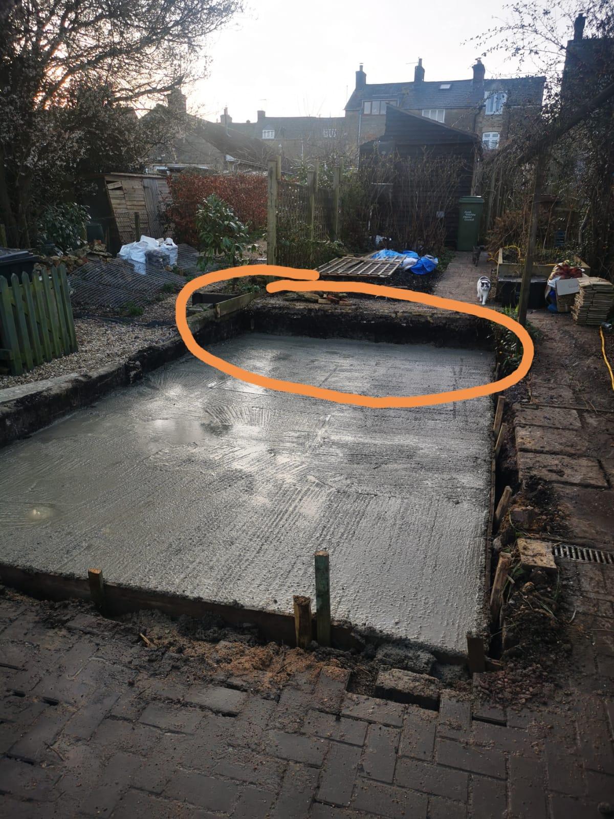 Building blunder sees wet concrete spewing into man's yard