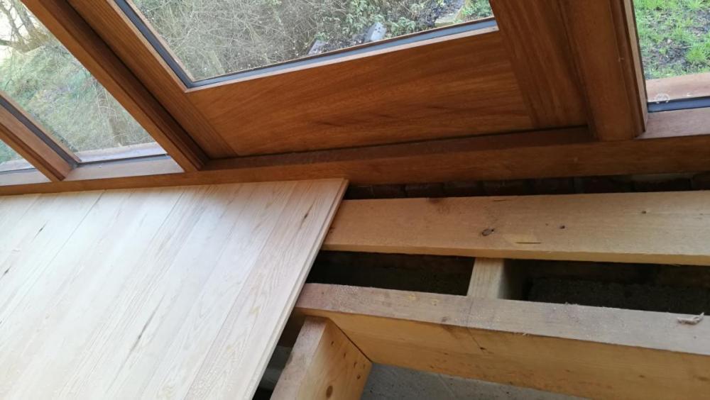 Pine boards against window frame.jpg