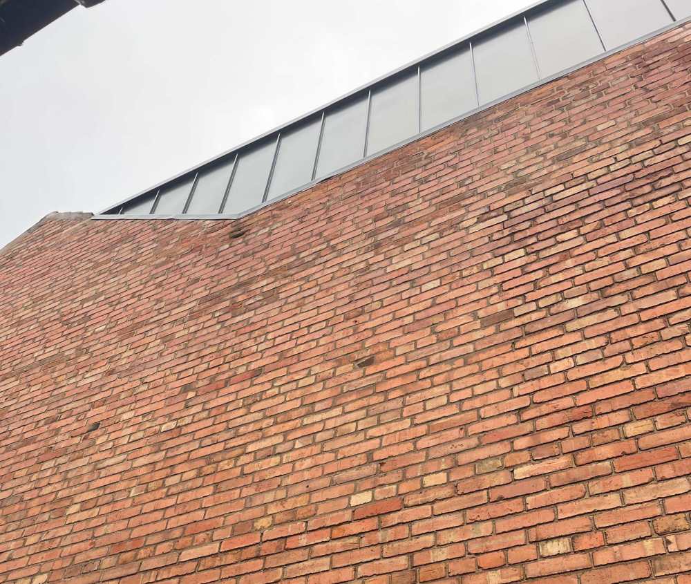 Party wall cladding - problem brick.jpg