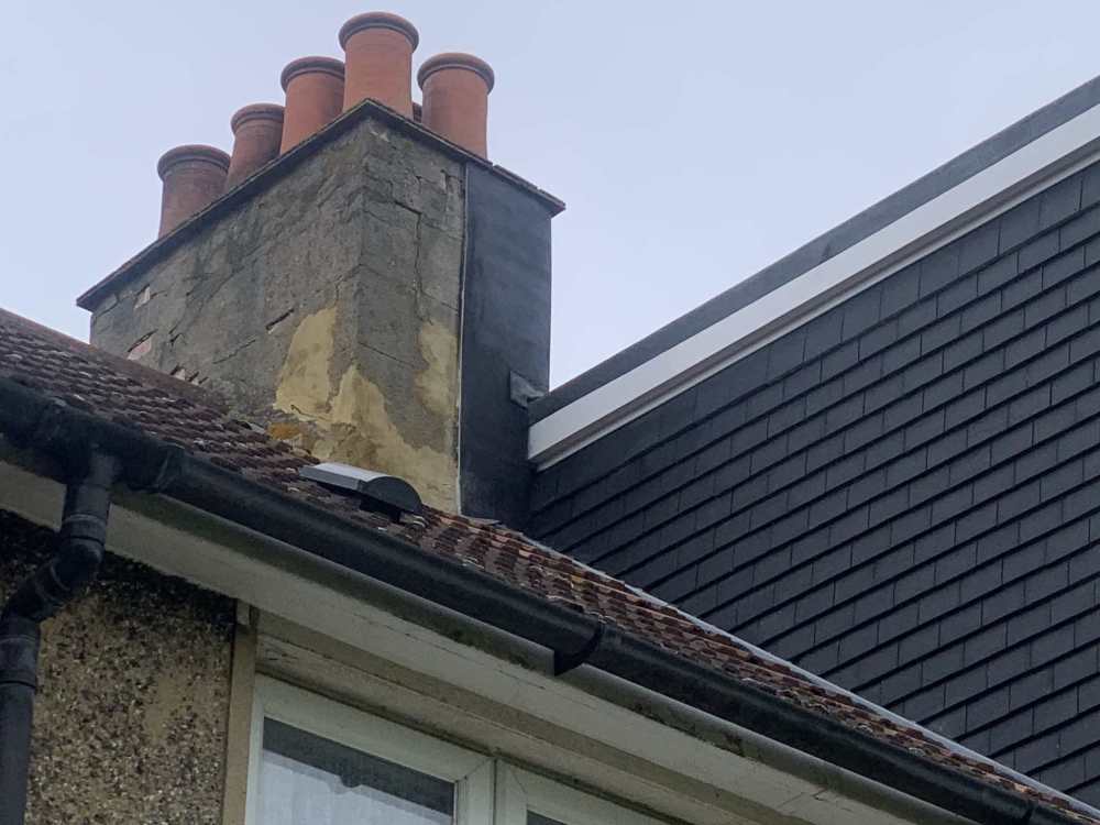 Chimney and roof tile join next to extension.JPG